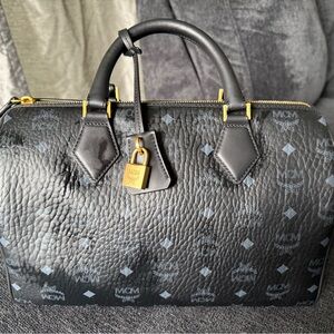 MCM Black and Gold Duffel Bag with Monogram Pattern